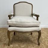 Fauteuil bergère en bois et lin naturel