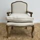 Fauteuil bergère en bois et lin naturel