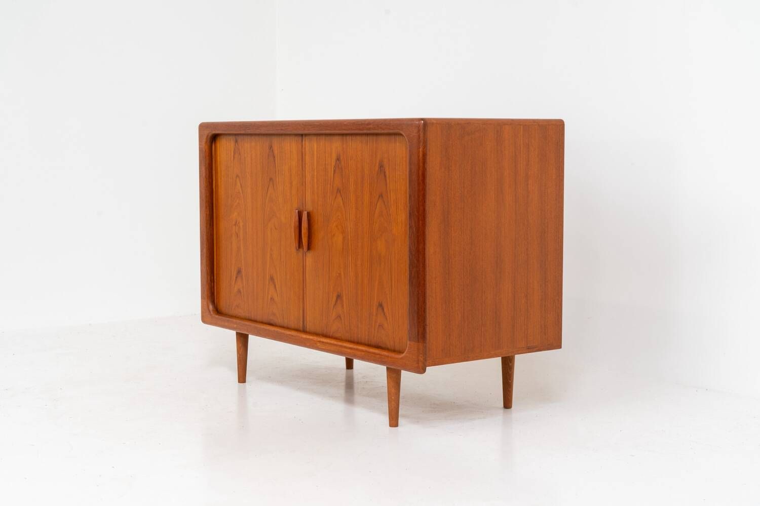 Svend Dyrlund teak sideboard with tambour doors (Denmark, 1960s).
