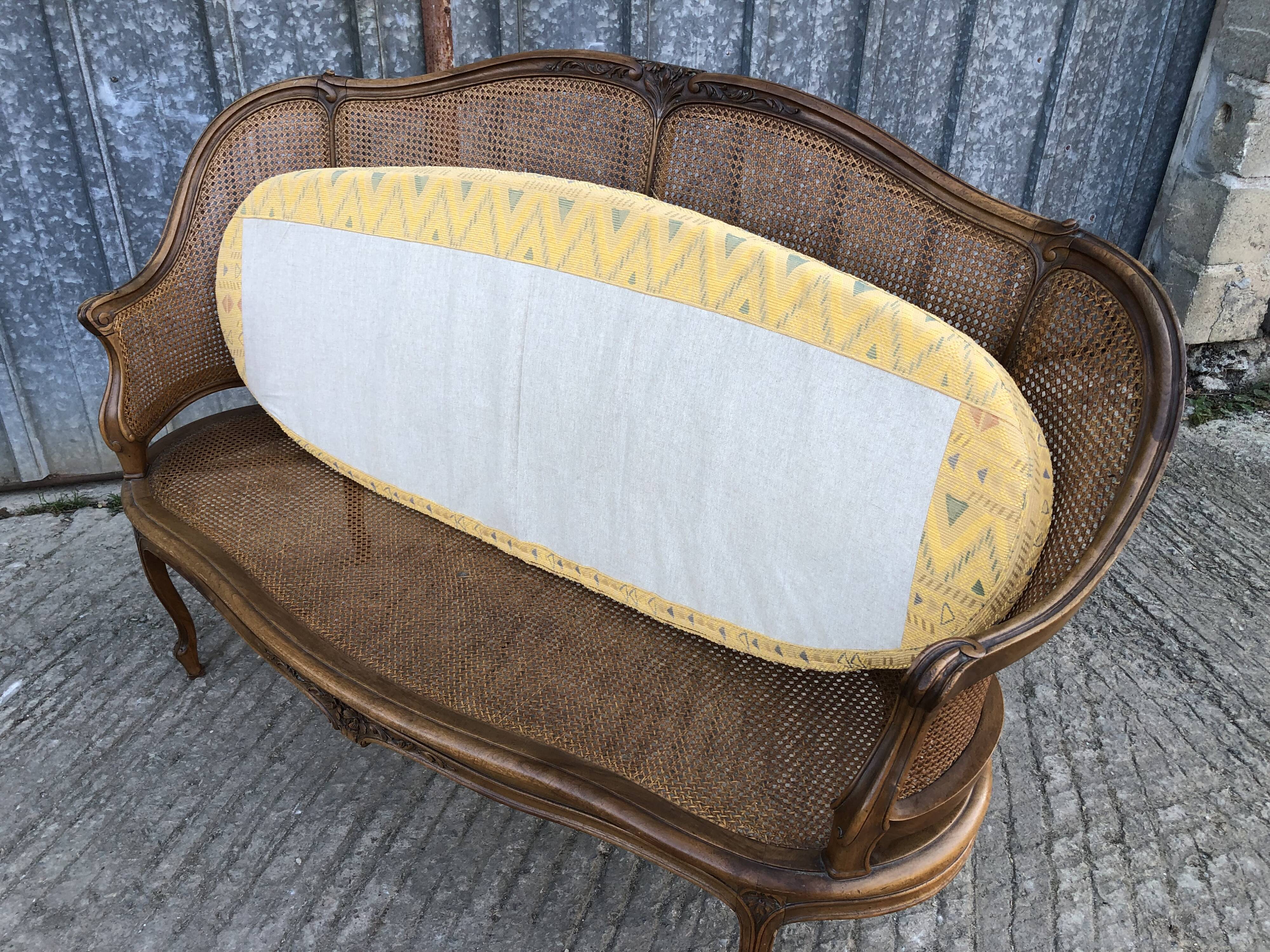 Antique Louis XV bench in solid walnut and caning