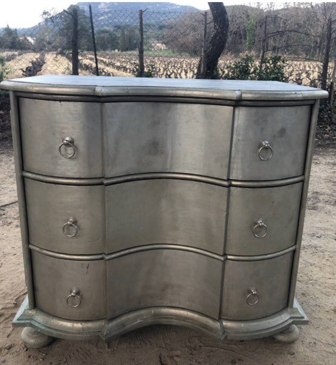 Noble wood designer furniture with a silver finish.