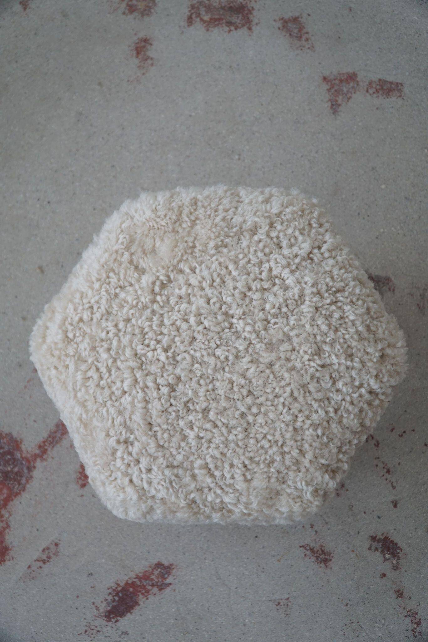 Modern Danish, a hexagonal oak stool, seat reupholstered in lambswool, 1950s.