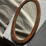 Small oval Art Deco mirror in brown and gold 33x54.
