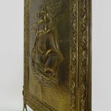 Fireplace screen in repoussé brass with a sailing boat. 1960s.