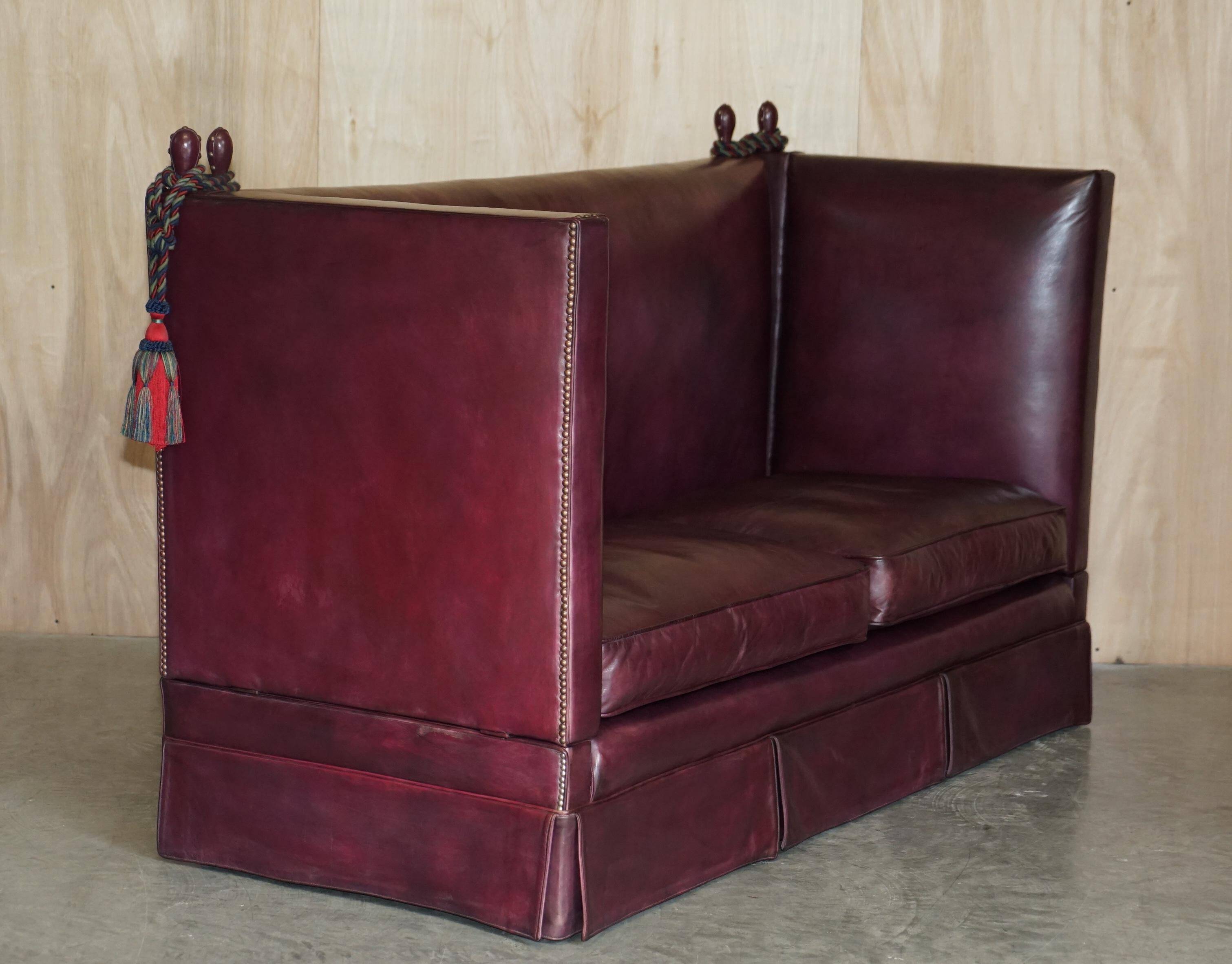 Victorian Knole canapé restored in leather with feather cushions.