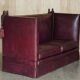 Victorian Knole canapé restored in leather with feather cushions.