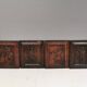 Four old wooden carvings to hang on the wall.
