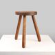 French hand crafted brutalist rustic low tripod stool in solid wood