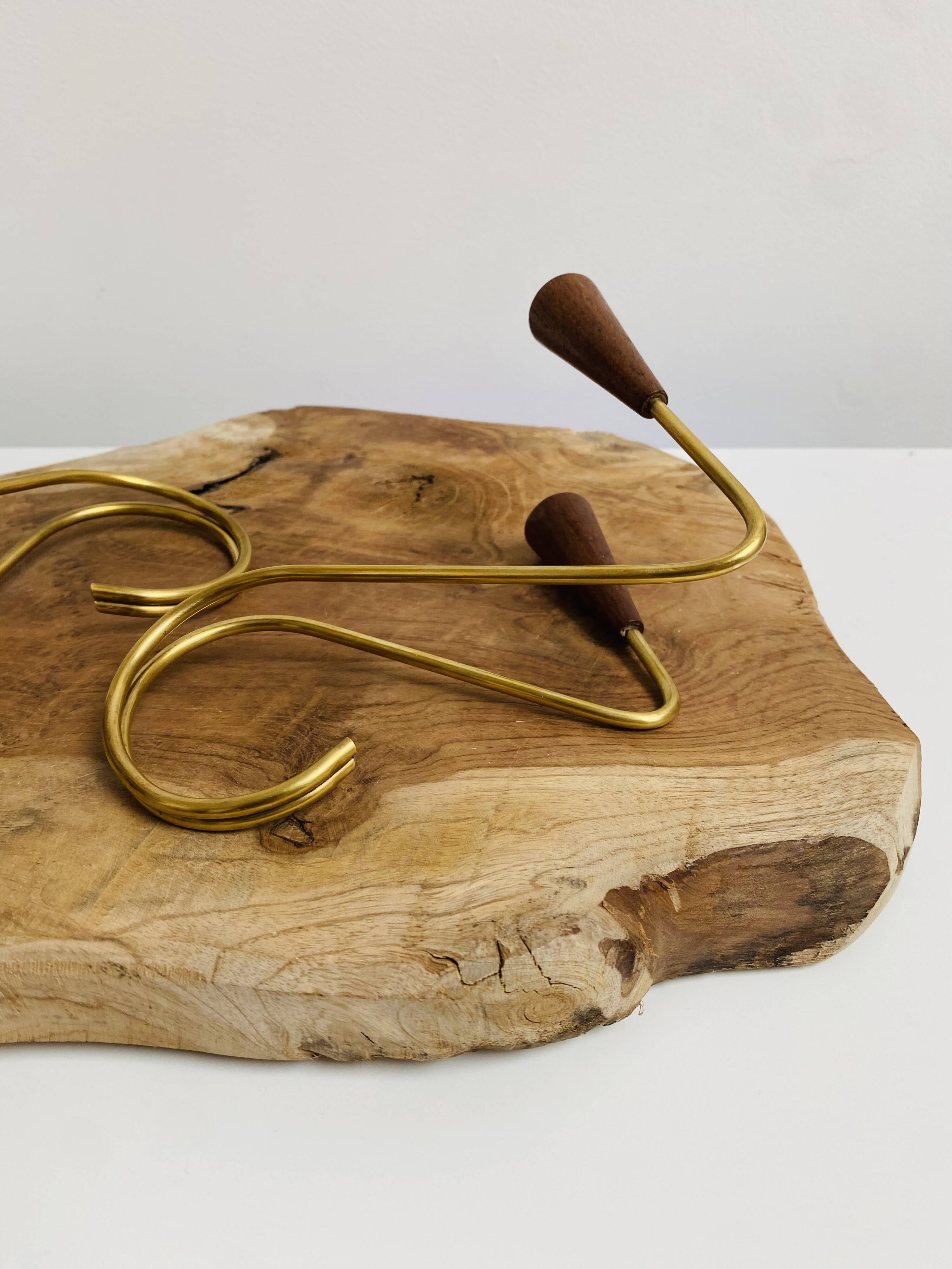 Pair of teak and brass candlesticks