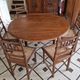 Extendable walnut table, 6 caned chairs in Henri II Neo-Renaissance style.