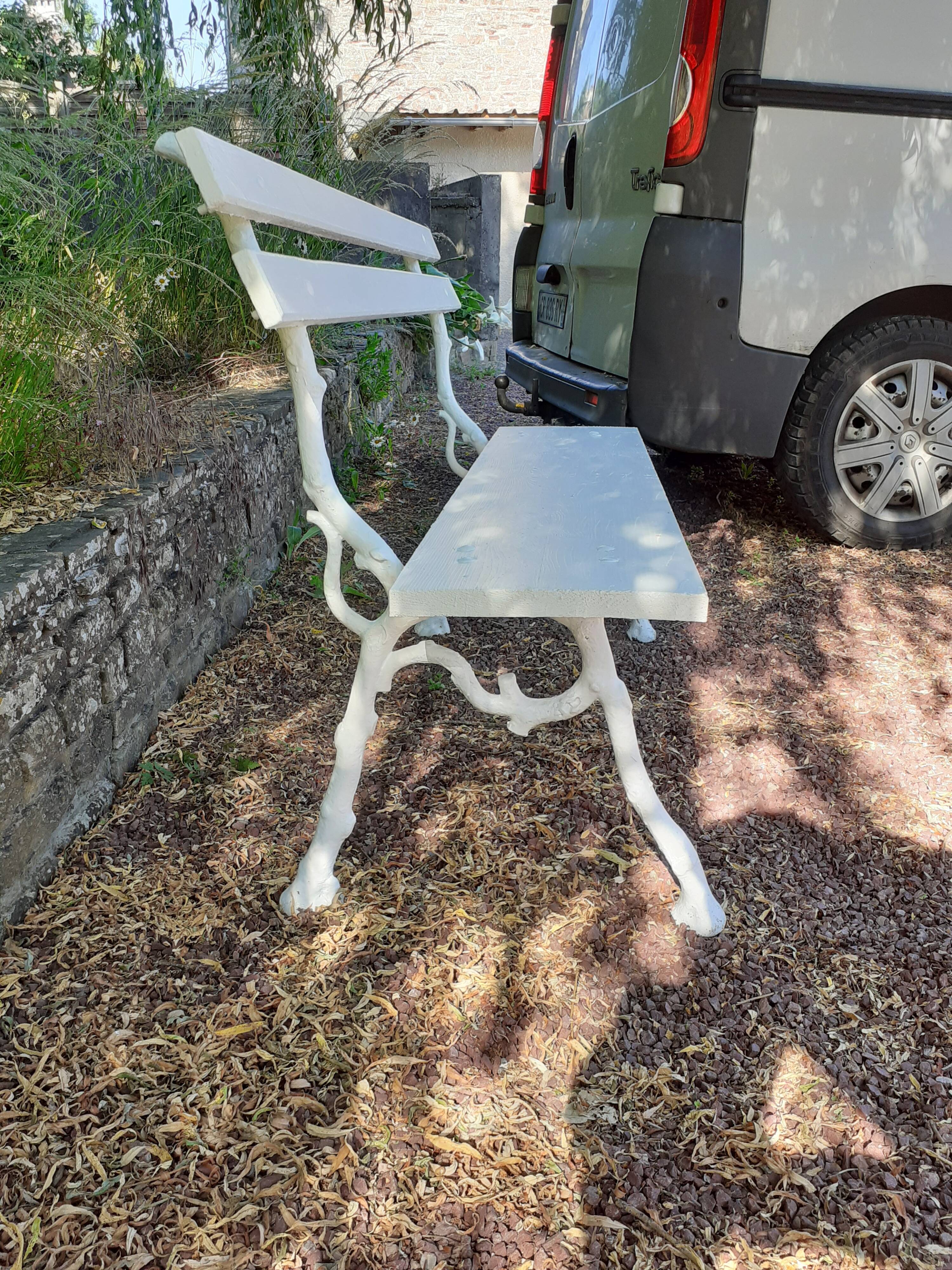 Old garden bench with cast iron feet and wooden planks