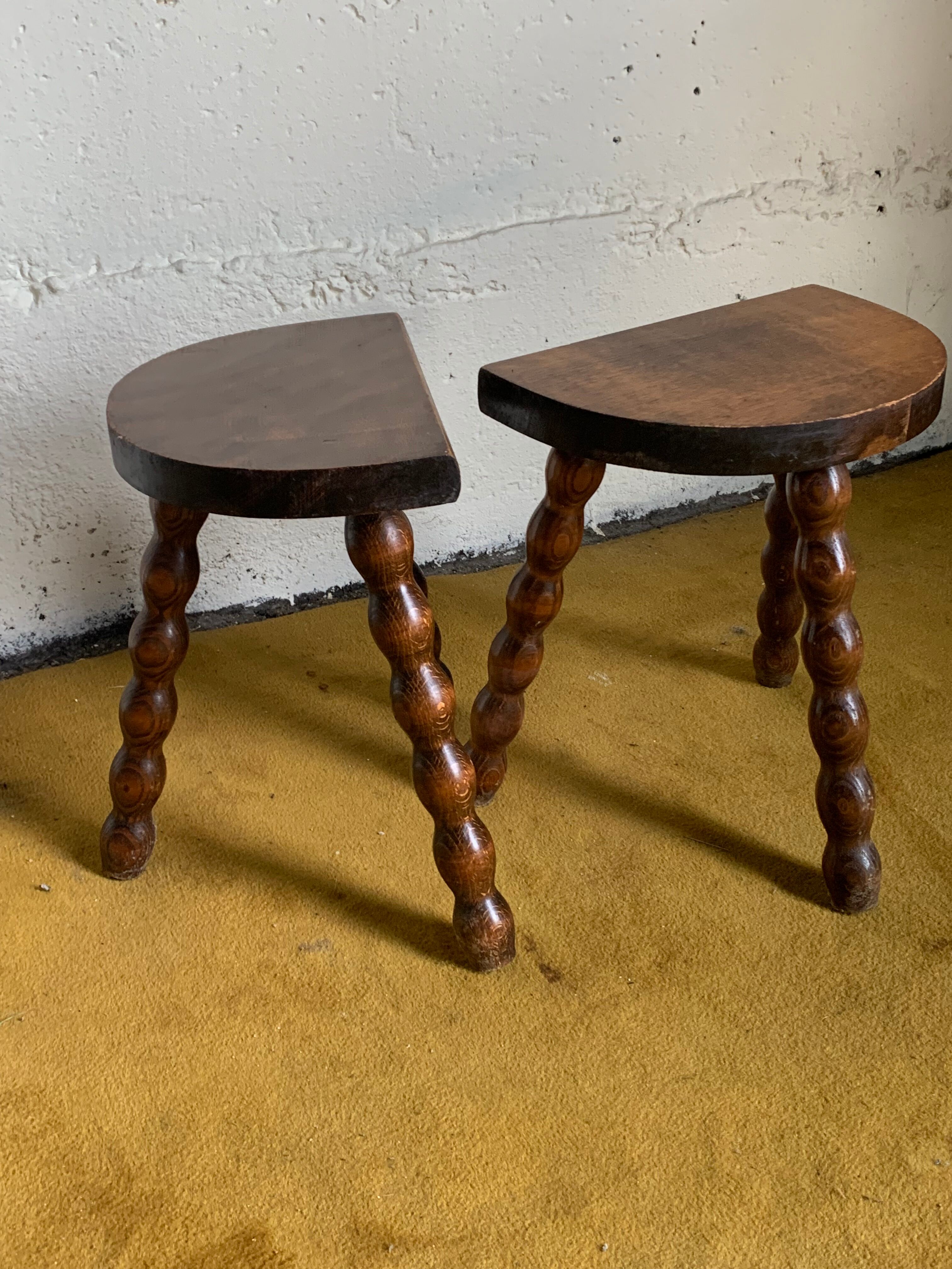 Duo of tripod half-moon stools