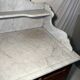 Antique wood and marble kitchen sideboard with carved backsplash