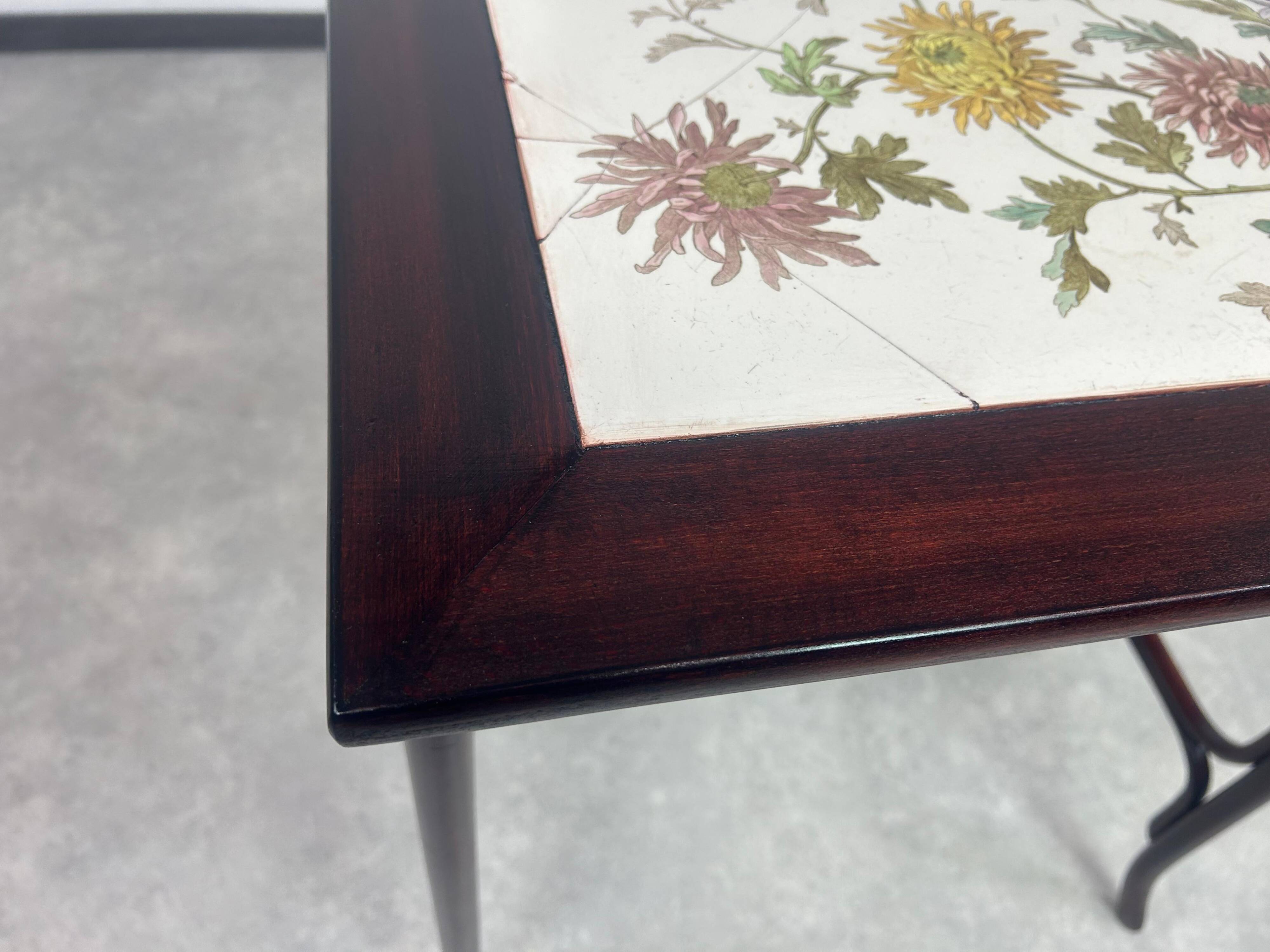 Nested tables in curved wood with ceramic top by Thonet.