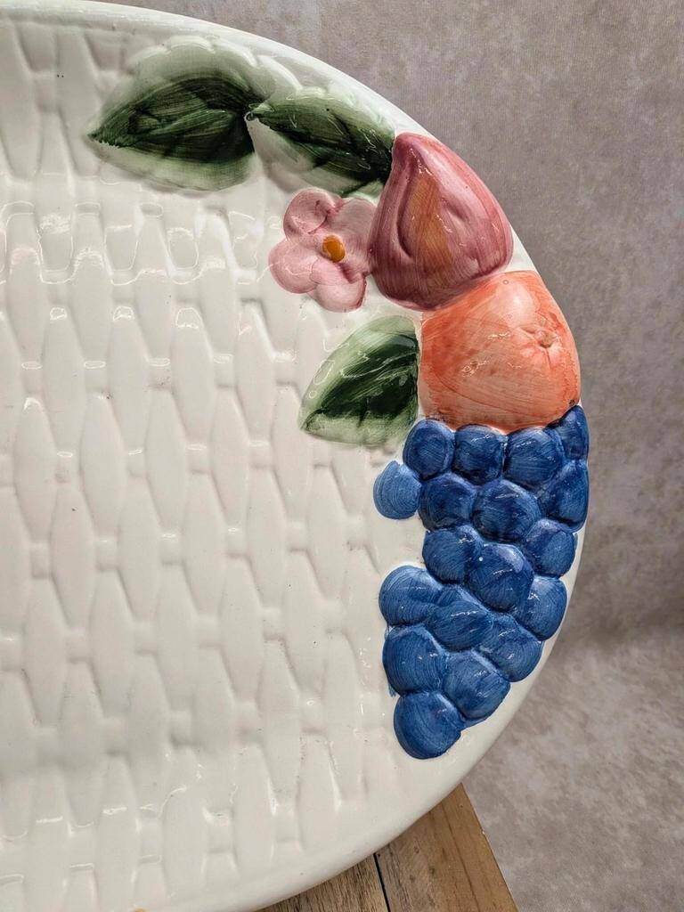 Vintage oval serving dish in majolica – Relief fruit decoration and woven basket design.