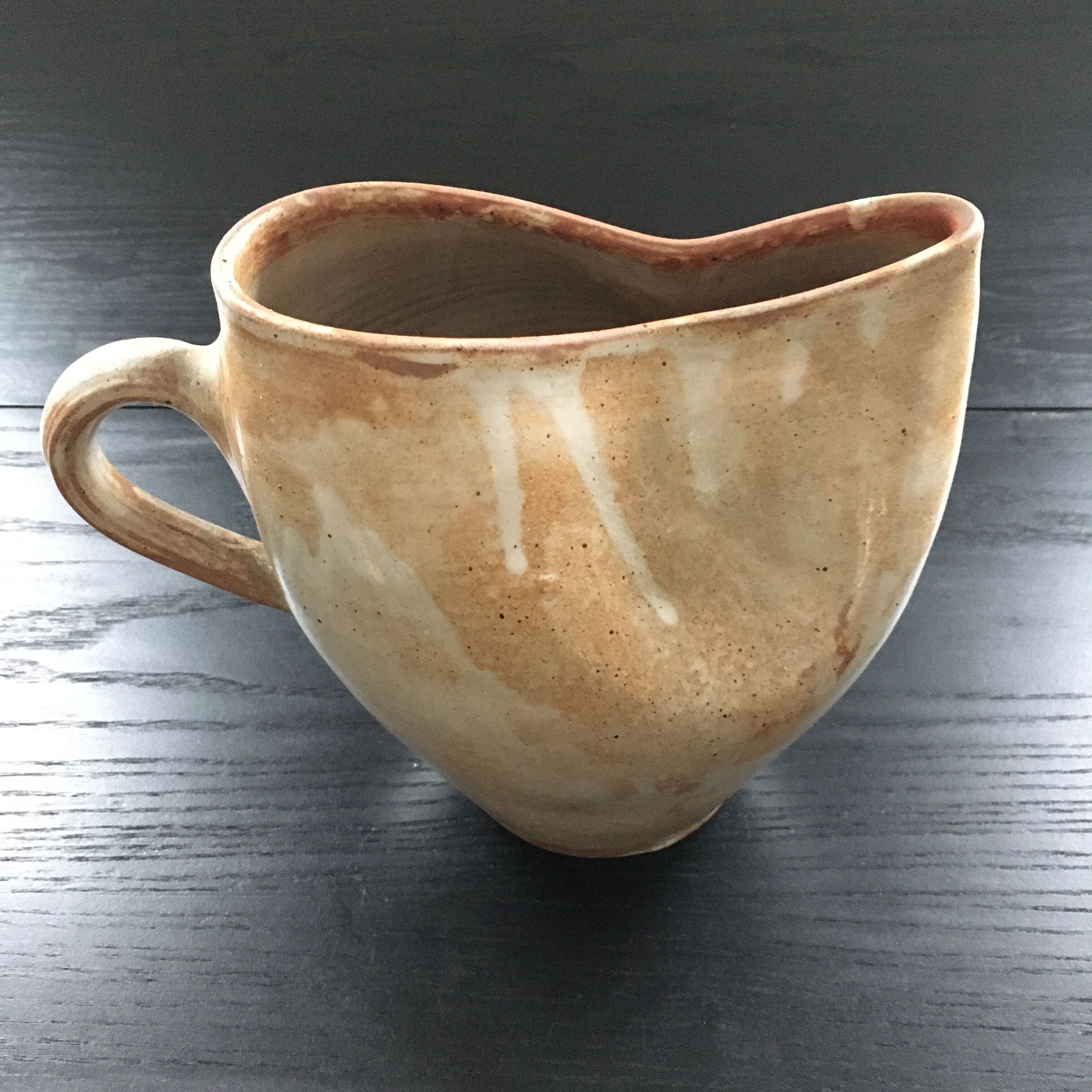 Beige stoneware pitcher with white drips