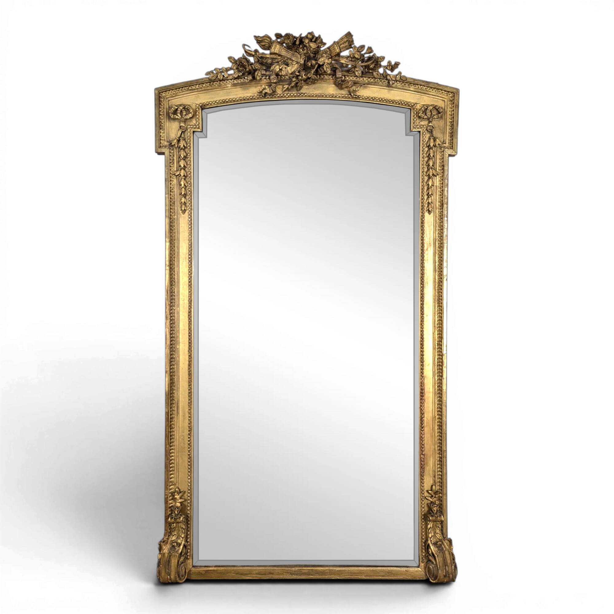Large gilded wooden mirror in Louis XVI style from the late 19th century.