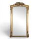 Large gilded wooden mirror in Louis XVI style from the late 19th century.