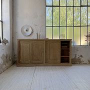 Large row of solid oak loom sliding doors