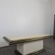 1980s coffee table made of brass tubes and laminate.