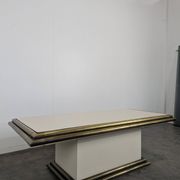 Table basse des années 80 en tubes de laitons et stratifié