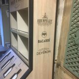 Store display for whisky and rum in metal and melamine