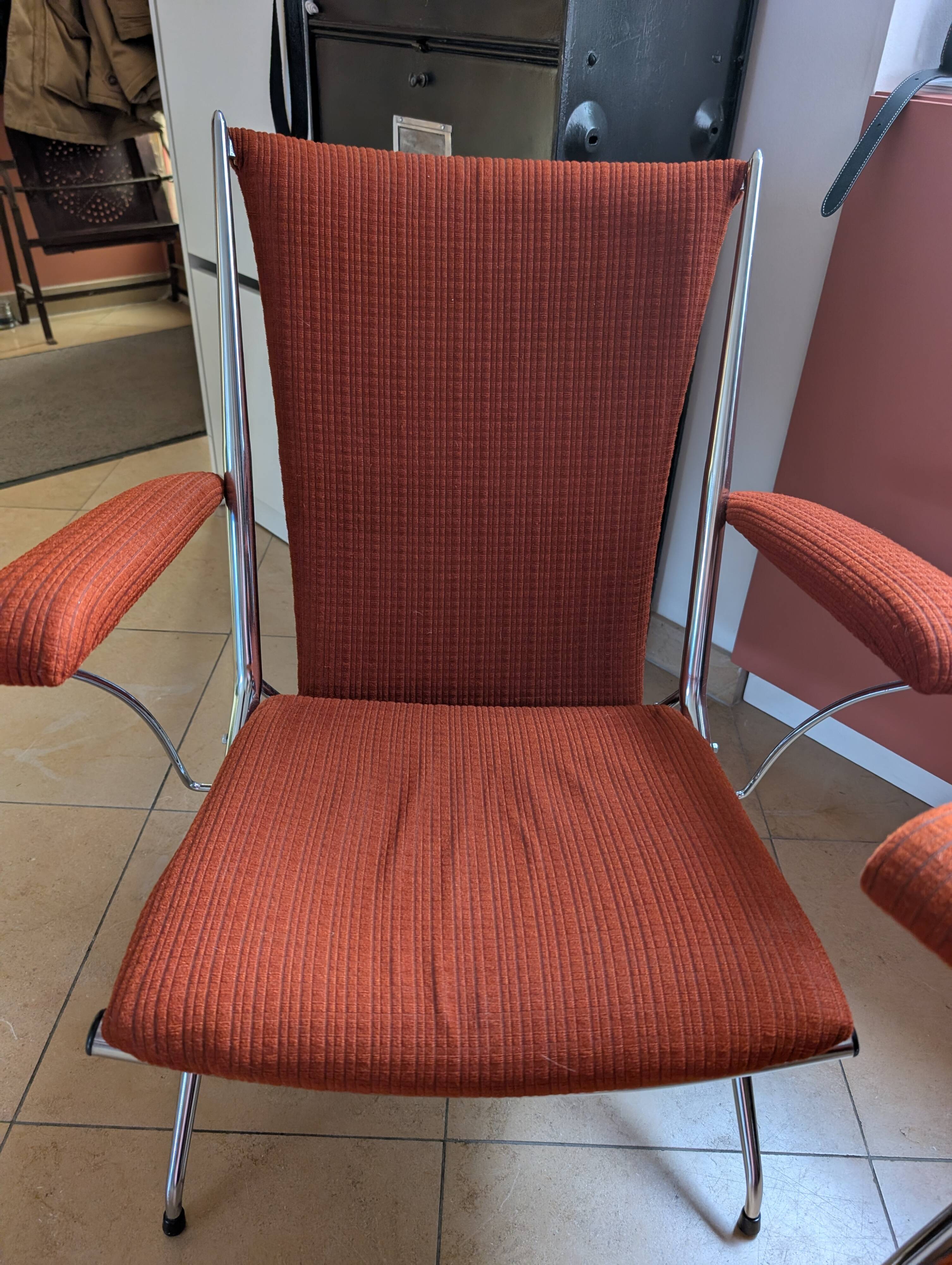 Pair of vintage folding chairs in terracotta fabric.