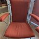 Pair of vintage folding chairs in terracotta fabric.