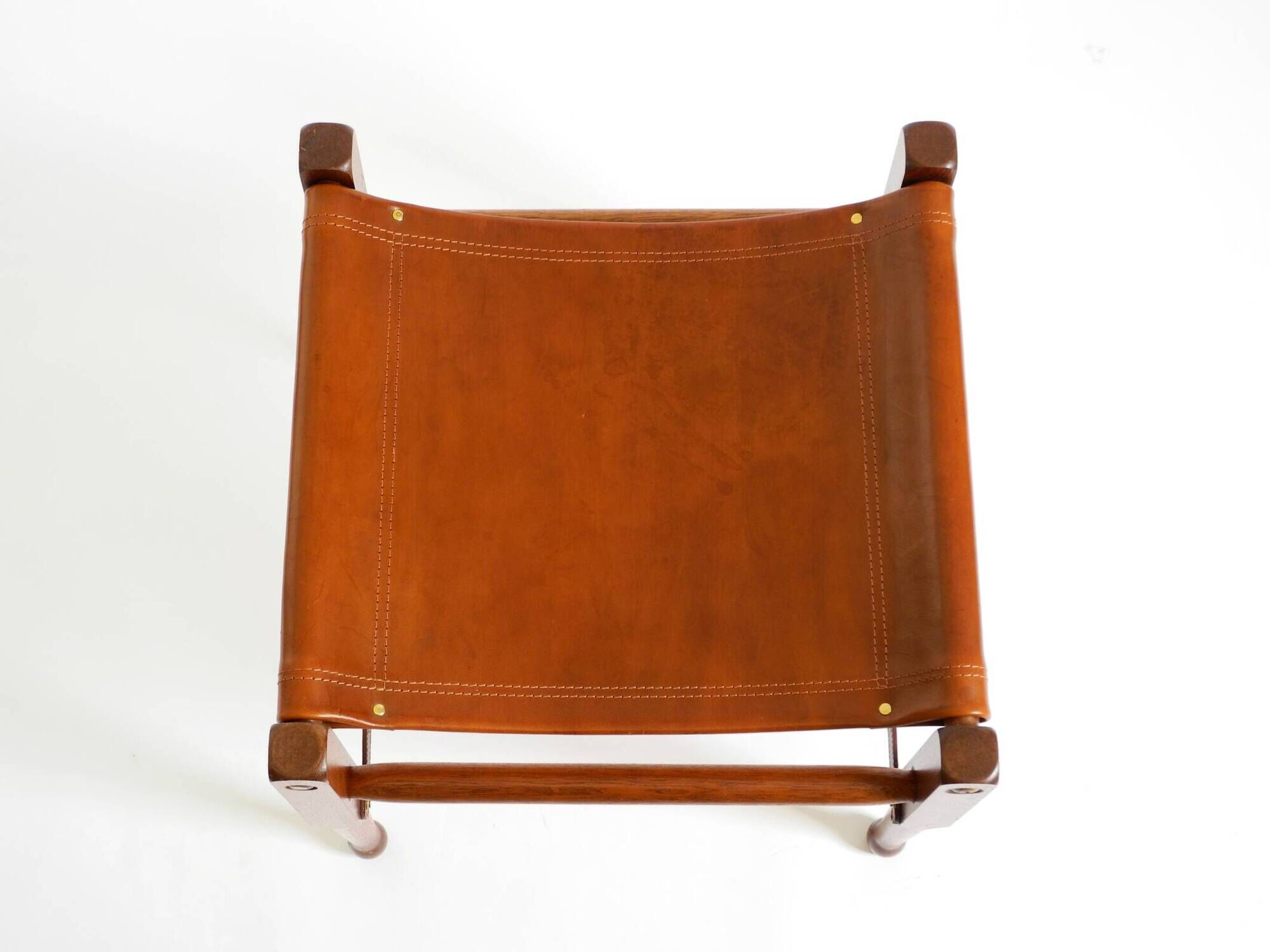 Rare 1990s safari stool with a teak frame and a seat made of brown saddle l
