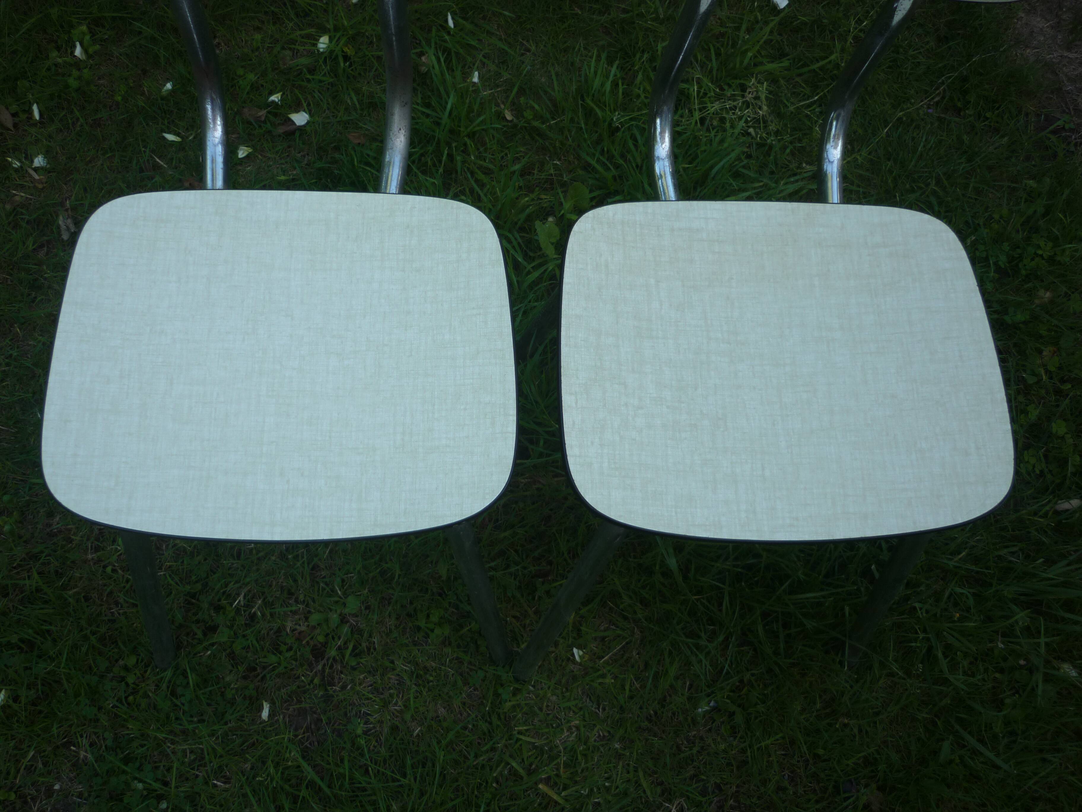 Pair of pale yellow formica chairs
