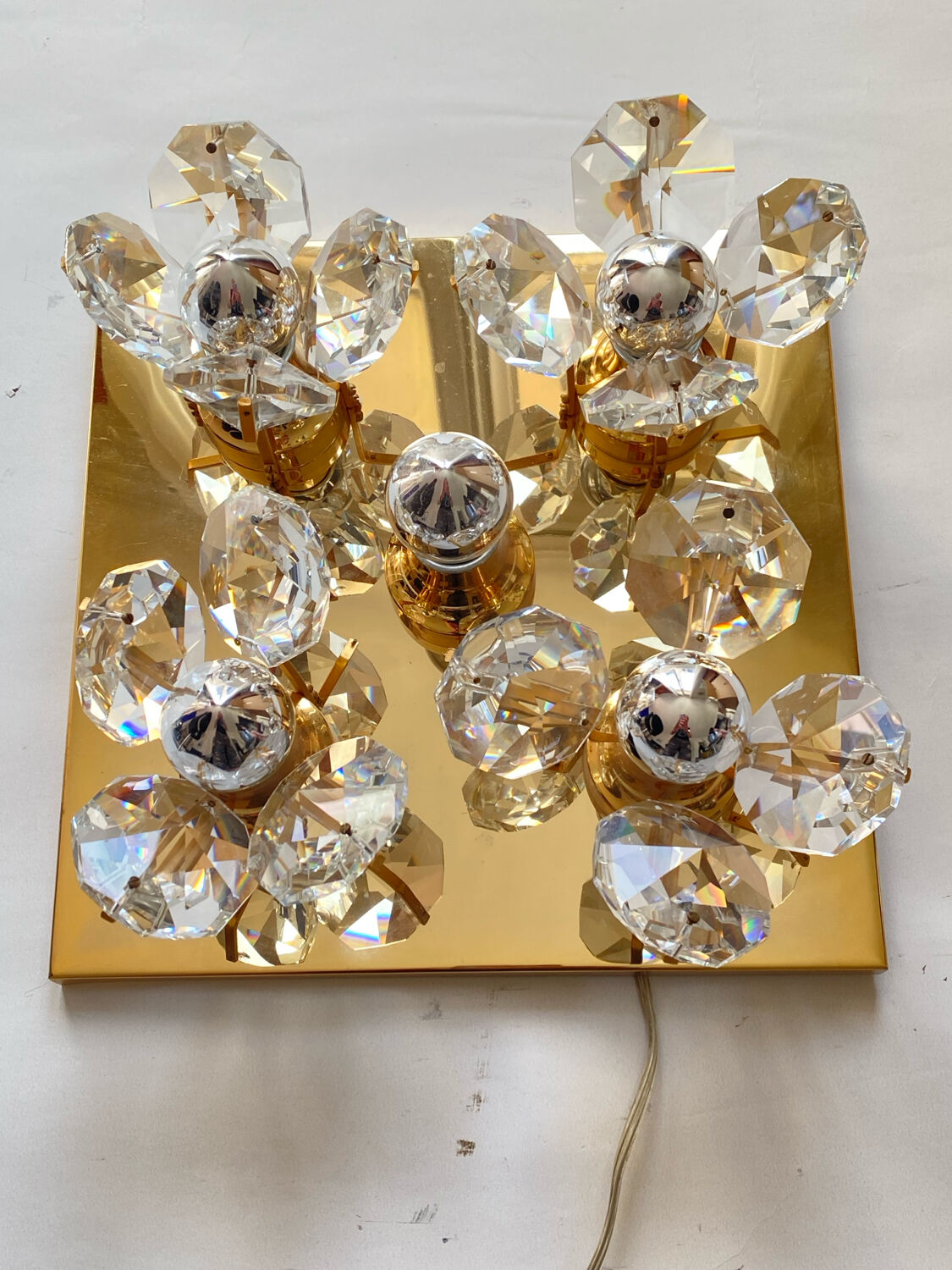 Brass wall lamp with glass prisms