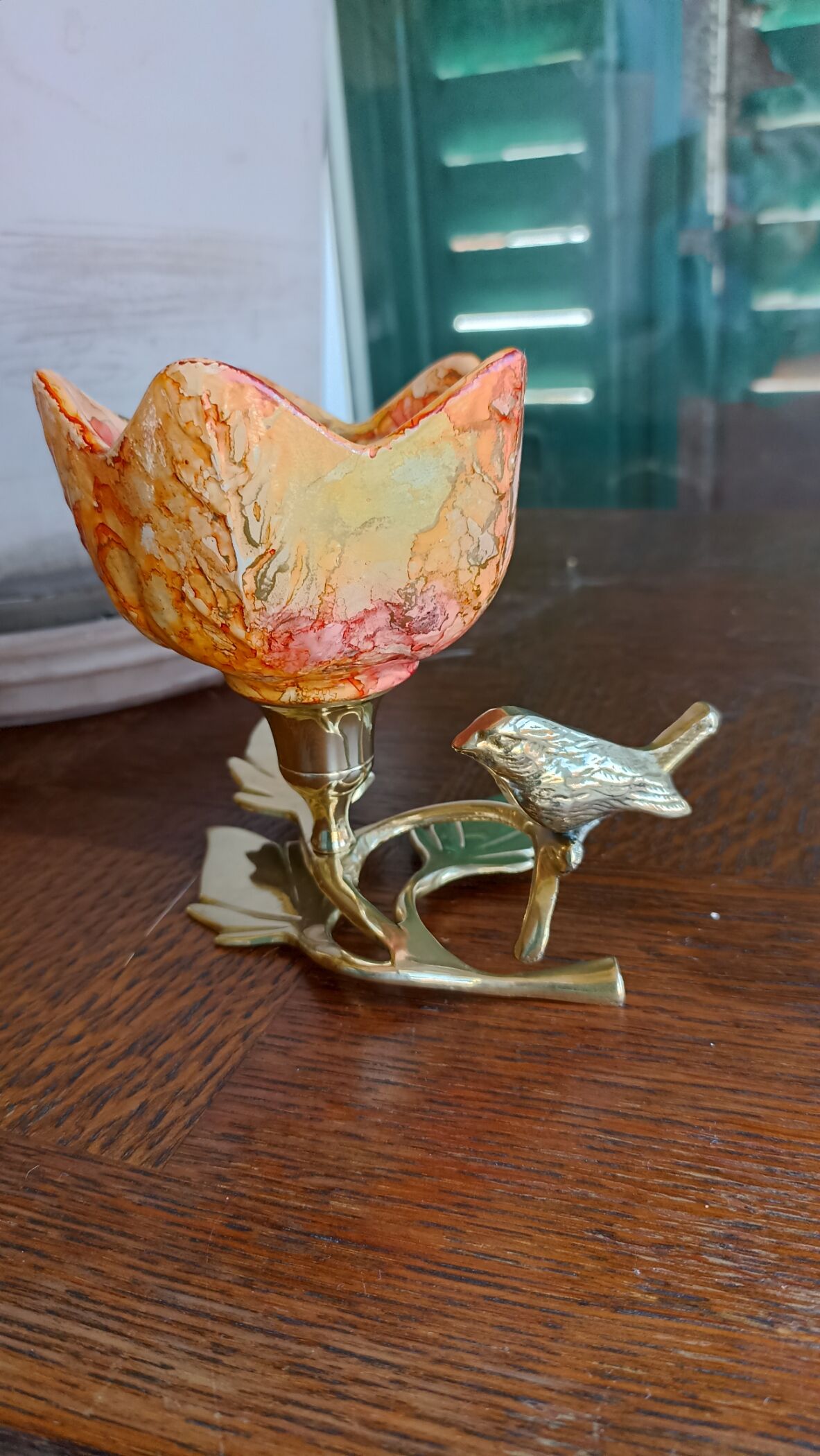 Brass cup in the shape of a bird and flowers