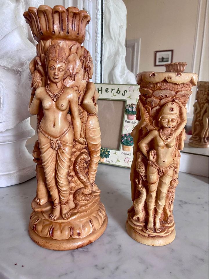 Two ancient Indonesian candlesticks.