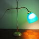 Desk lamp in brass with a swan neck and green opaline glass.
