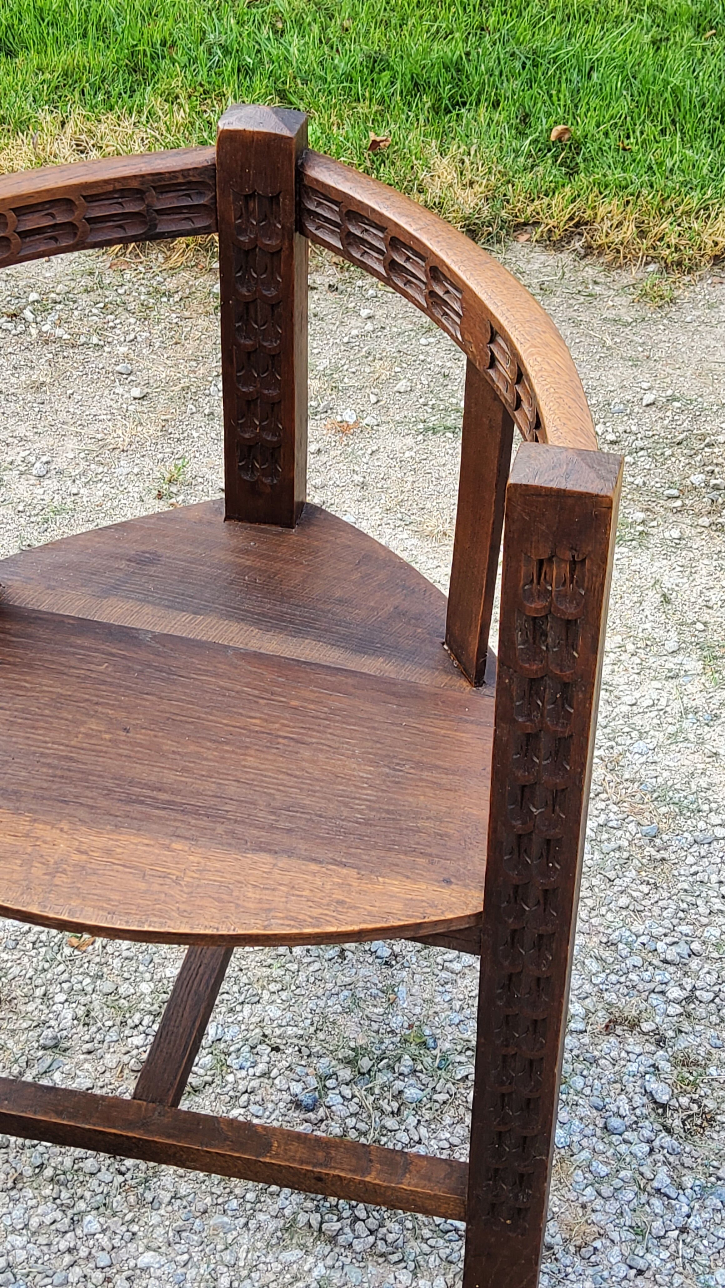 Set of three brutalist tripod armchairs in carved solid oak