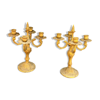 Pair of four-pointed gilded brass candlesticks