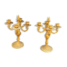 Pair of four-pointed gilded brass candlesticks