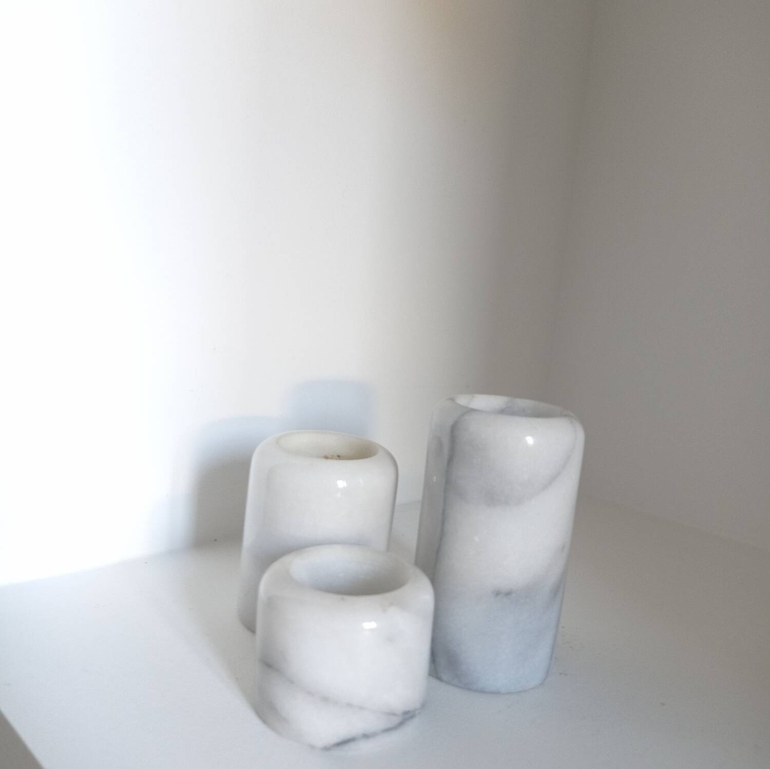 Trio of marble candlesticks