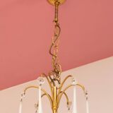 Large golden Italian chandelier with white opaline drops.