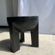 Black mango wood tripod side table with a semi-spherical top, height: 45 cm, diameter: 44 cm.