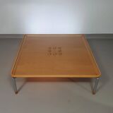 Rare coffee table 110 x 110 x height 35 cm with 8 flange wooden / cork caps in the glass top.