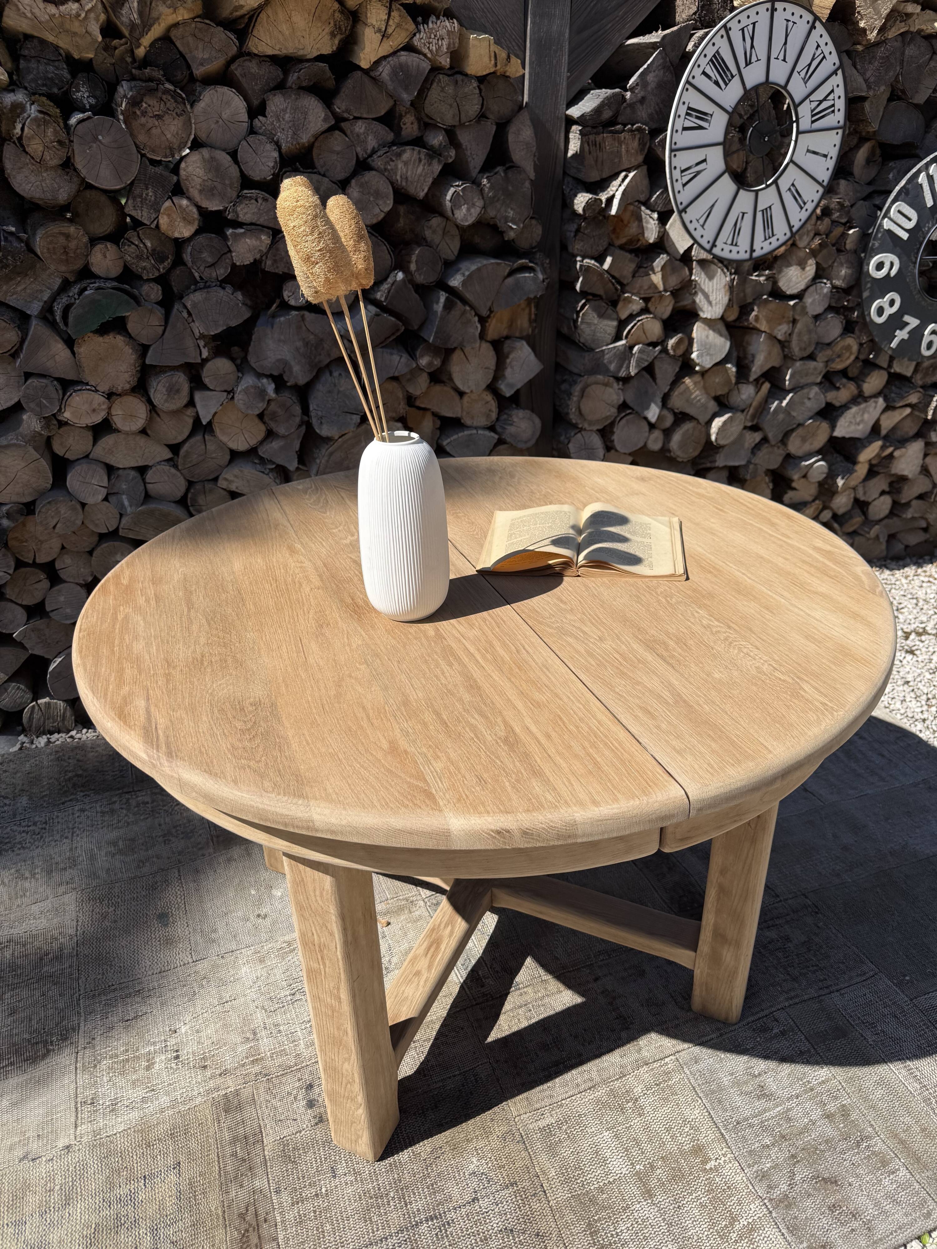 Round solid oak table with extensions, maximum 220cm.