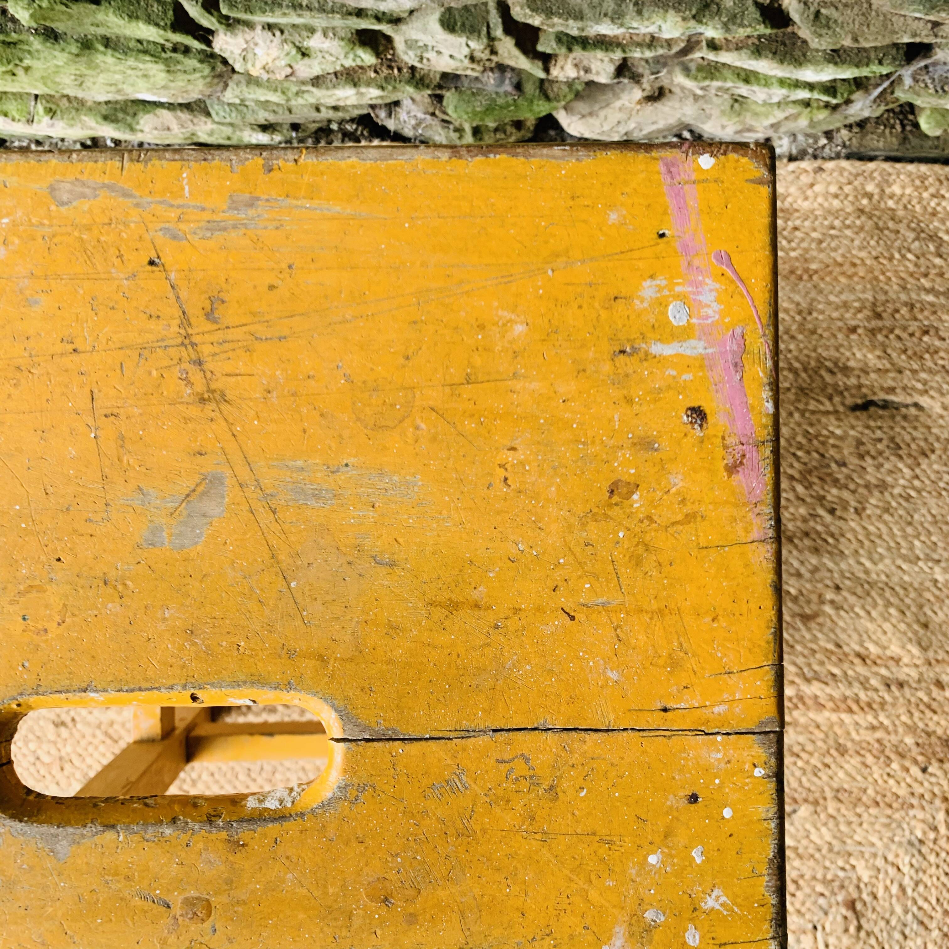 Yellow wooden high stool