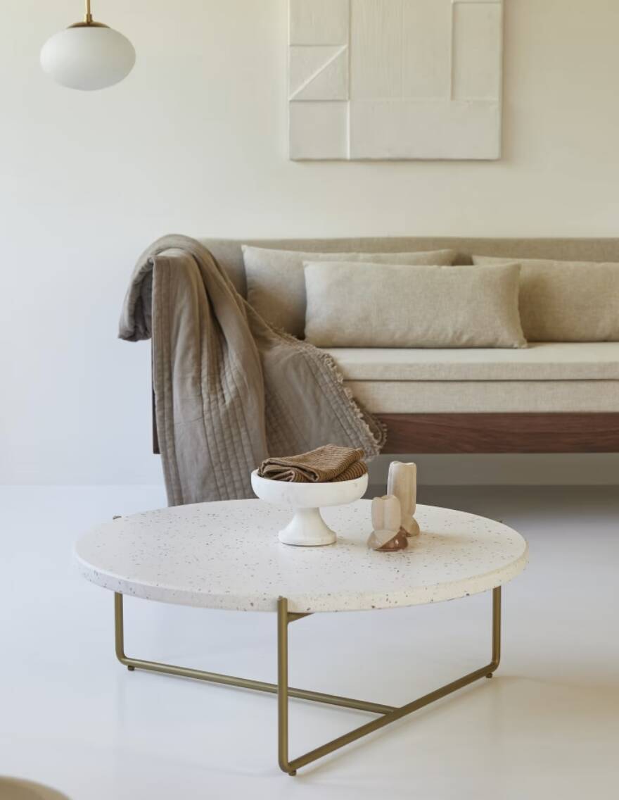 Anatole coffee table in terrazzo and confetti metal by the brand Tikamoon.