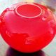 Pot-bellied, art deco vase in speckled ruby red multi-layered glass, white interior