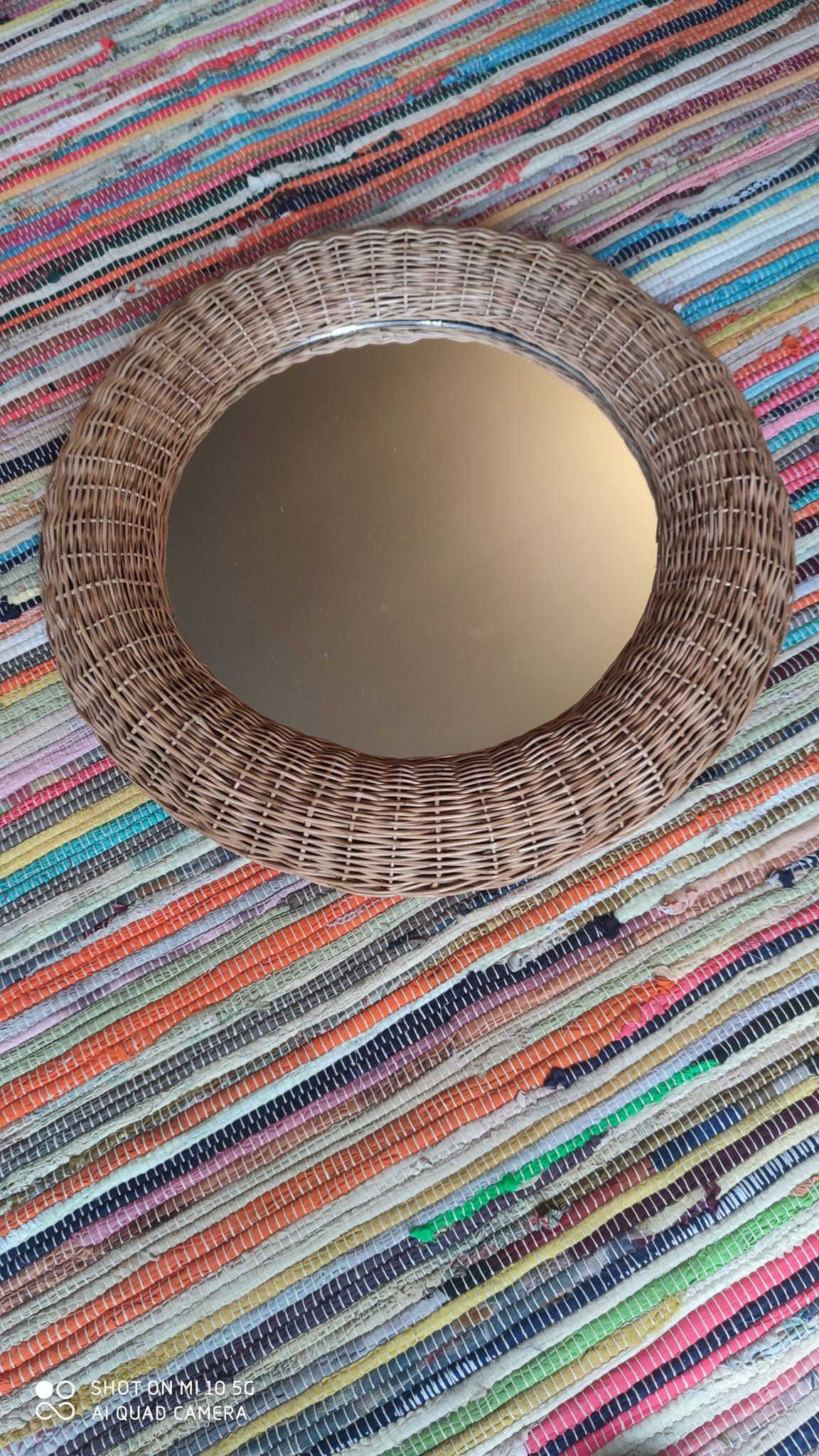 Miroir en rotin de forme sphérique vers 1970