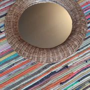 Miroir en rotin de forme sphérique vers 1970