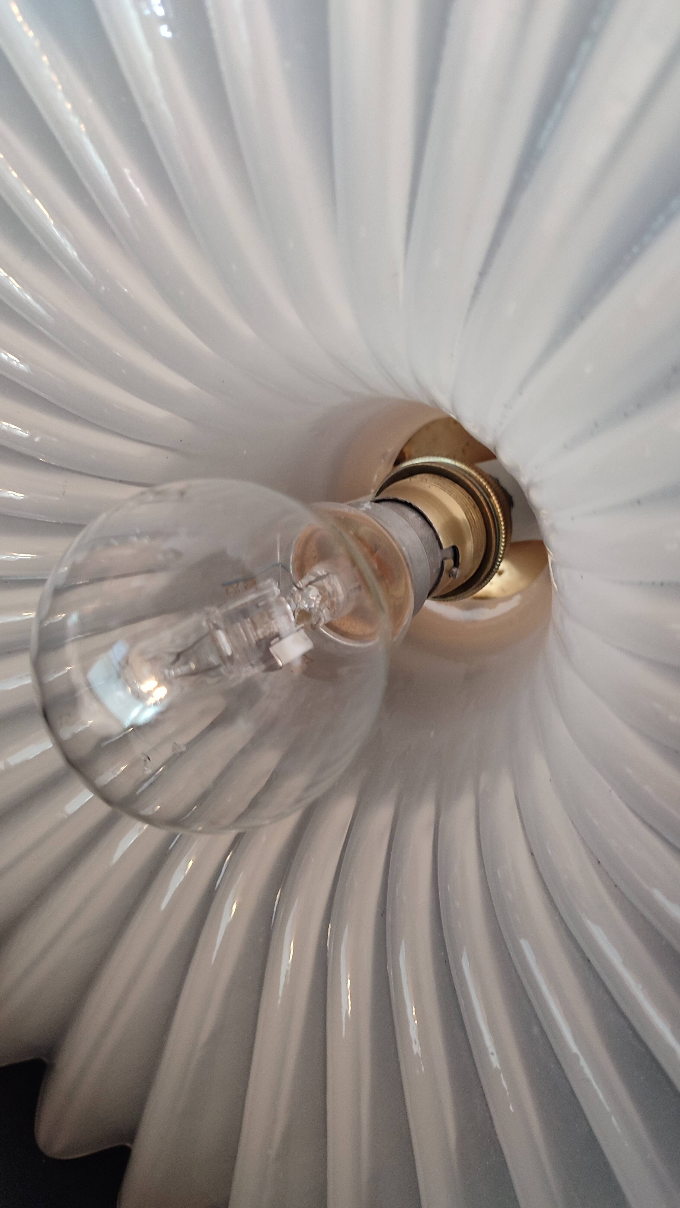 Round pendant light in pleated semi-opaque glass