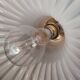 Round pendant light in pleated semi-opaque glass