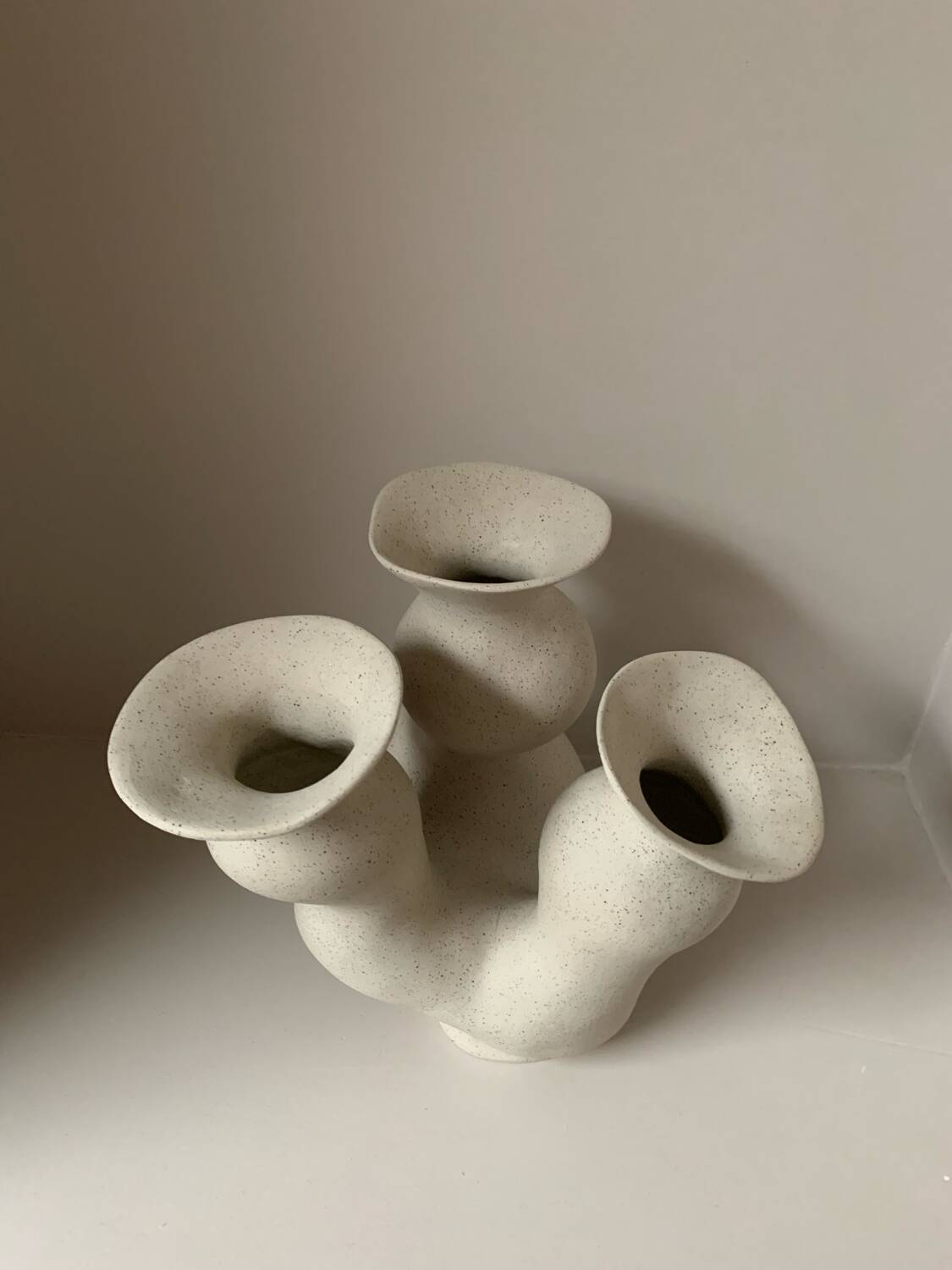 Organic-shaped vase in pyritic stoneware.